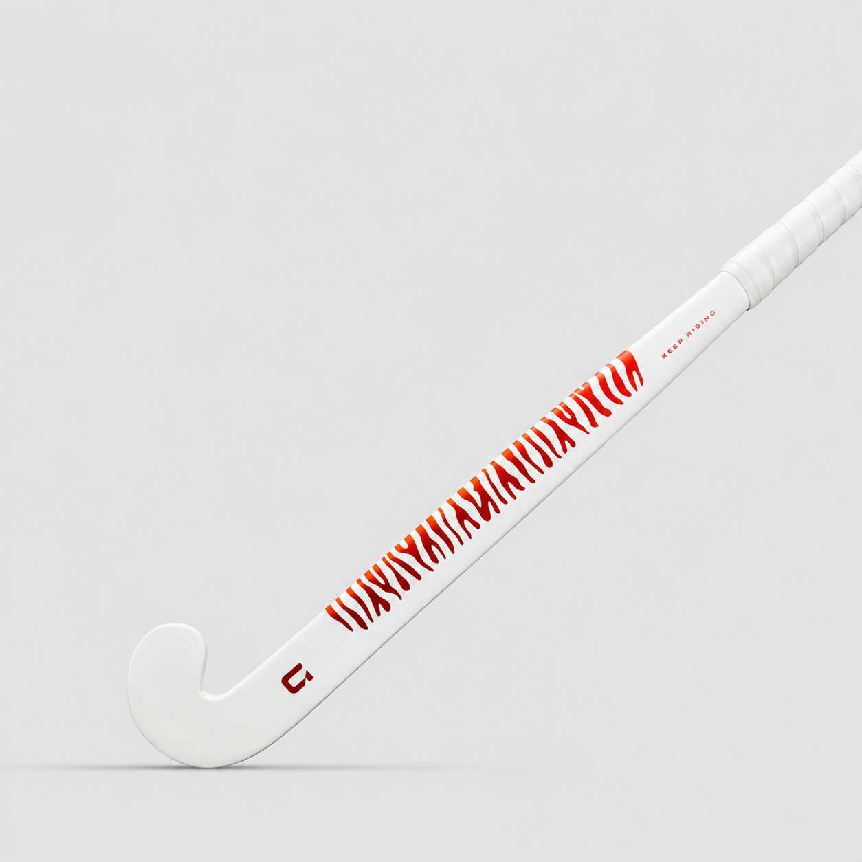 GRINT TIGRISE field hockey stick in white hot coral